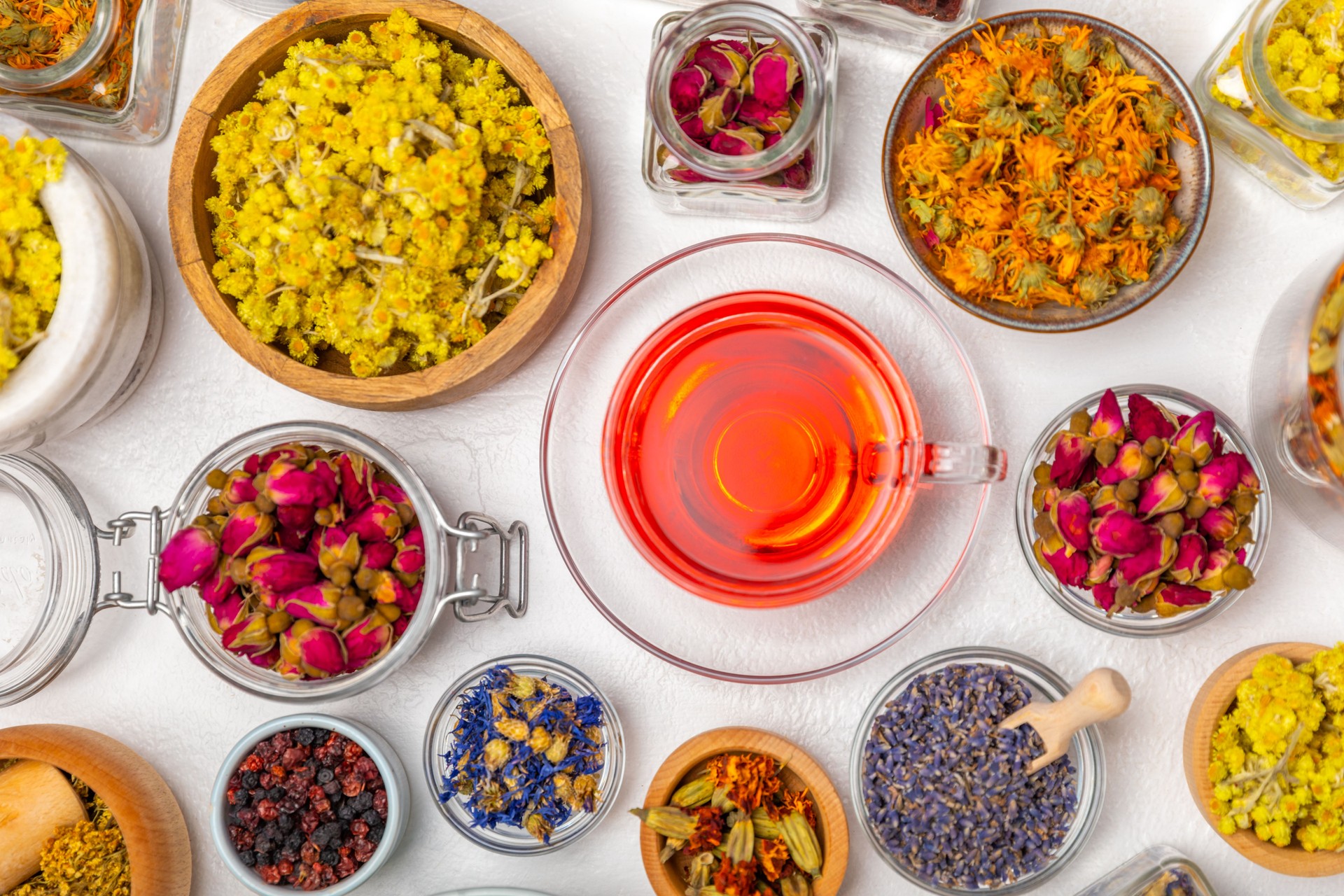 Assortment of dry herbal and berry tea on background.Medicinal Healing herbs.Alternative medicine concept.Linden, calendula, cornflowers, marigold, tansy, tea rose.dry herbal
